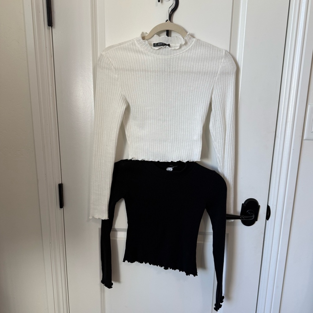 Two mock turtleneck long sleeve tops. One black one white